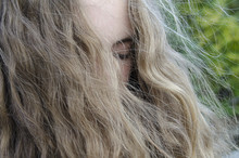 Close Up Of Teenage Girl With Eyes Closed And Long Blonde Hair