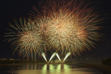 Fireworks Reflecting On A Lake; Calgary, Alberta, Canada