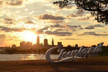 Sunrise over Cleveland sign and skyline at Lake Erie Edgewater park