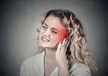 Tinnitus. Sick Female Having Ear Pain Touching Her Painful Head