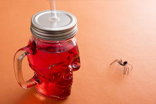 Red Drink In A Halloween Jar With Spider