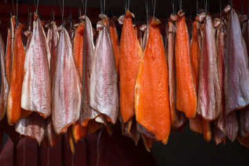 Salmon hanging for smoking in ordered pattern