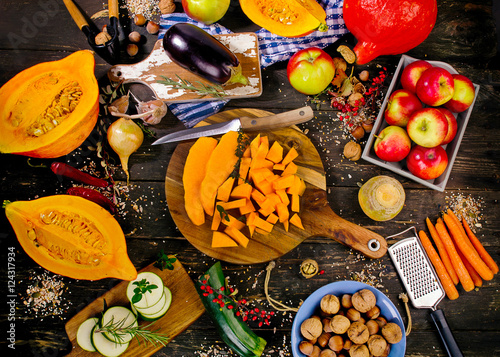 Autumn vegetables and fruits on a dark rustic wooden background. Plakat
