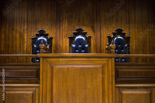 Empty bench with judge chairs in courtroom - Buy this stock photo and