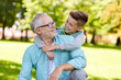 © Syda Productions - grandfather and grandson hugging at summer park