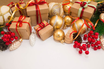 Christmas or New Year background: fur-tree, branches, gifts, colored glass balls, decoration and cones on a white background