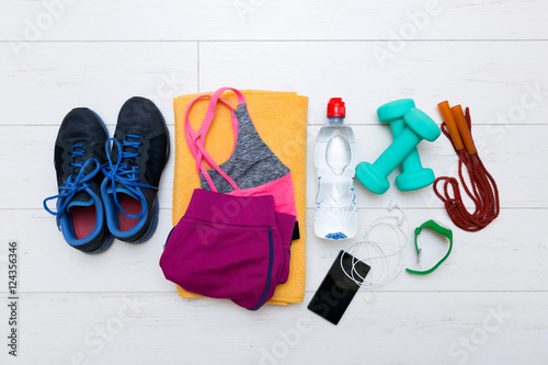 Cuadros en Lienzo top view of fitness workout items on white gym floor