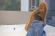 Man relaxing at the office with his feet on the table.