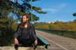 © Rob Rye - Portrait of man with a long beard and a long hair on the bridge