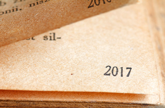2017 new year numbers on the page of book background concept