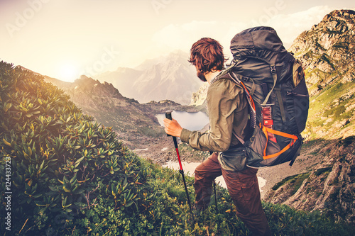 Fotomural Man Traveler with backpack mountaineering Travel Lifestyle concept lake and moun