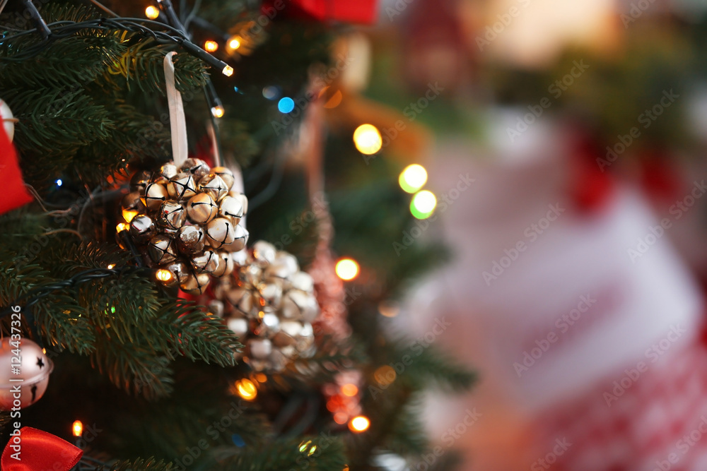 Close up view of beautiful jingle bells on Christmas tree