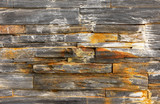 Fototapeta Desenie - Closeup of rusty natural stone wall background, sandstone, limes