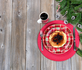 Wall Mural - Christmas breakfast setting with evergreen branches on wood