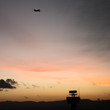 © snapin - Airplane departed from airport at sunset time with secondary sur