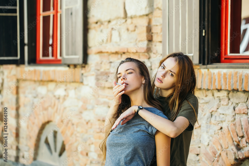 Two girls smoking cigarette Stock Photo