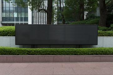 Large blank billboard on a street wall, banners with room to add your own text