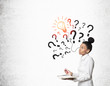 © ImageFlow - African girl with notebook and light bulb with question marks