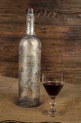 Wall Mural - old wine bottle and glass of wine