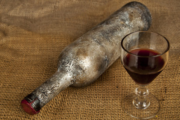 Wall Mural - old wine bottle and glass of wine