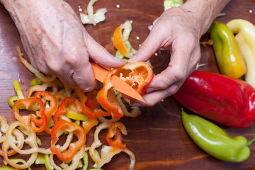 Wall Mural - woman cutting pepper