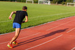 © snedorez - Portrait in full growth of running man on track outdoors