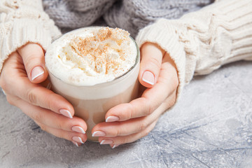 woman hands with a latte