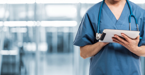 Healthcare And Medicine. Doctor using a digital tablet