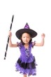 © Danai - Little halloween witch girl costume isolated on white background