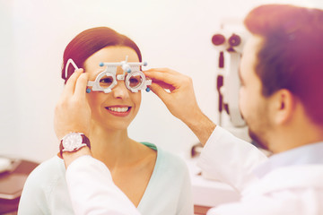 Wall Mural - optician with trial frame and patient at clinic