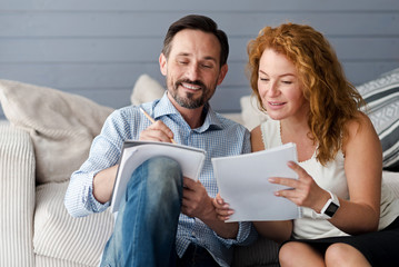 middle-aged man and woman couple making notes