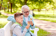 © Syda Productions - old man and boy eating ice cream at summer park