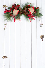 White barn door with rustic Christmas decoration