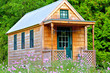 © lowphoto - View of tiny house on wheels