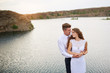 © timonko - young beautiful couple bride and groom at wedding walk by the lake