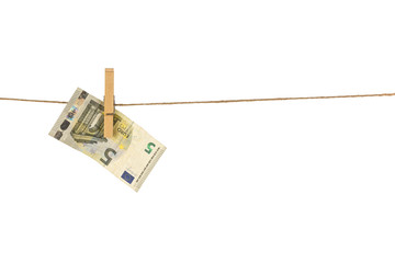 5 Euro banknote hanging on clothesline on white background.