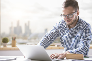 Poster - Caucasian businessman using laptop