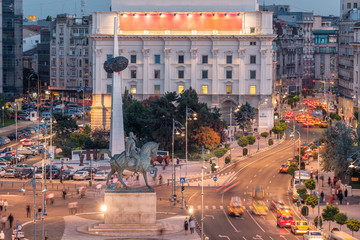Long exposure aerial shot of the Revolution Square near Victoria Avenue in Bucharest, Romania. Traffic and historical buildings.Bucuresti