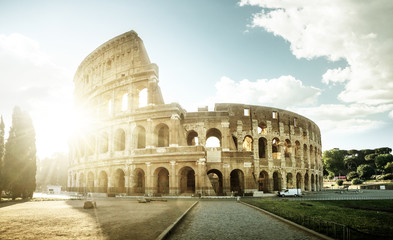 Wall Mural - Colosseum in Rome and morning sun, Italy