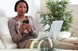 © grinny - African-American woman with smartphone.