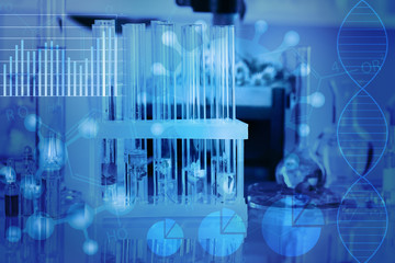 test tubes with different flowers, blue toned. scientific research concept.