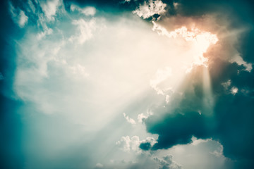 Dramatic Sky and Sun Rays Background. Toned Photo.