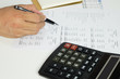 © kithanet - Hand of accountant checking financial document