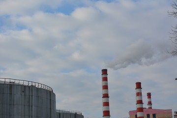 Pipe thermal power plant on a background of blue sky, industry