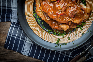 Wall Mural - Potato pancakes with meat stew served on a plate.