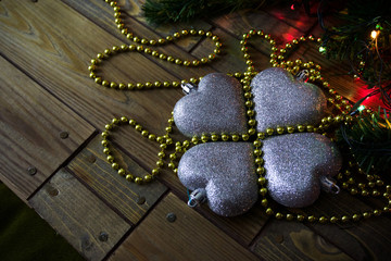 tree toy silver heart Christmas decorations on a wooden backgrou