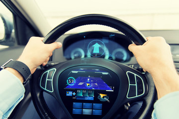 Poster - close up of man driving car with gps navigator