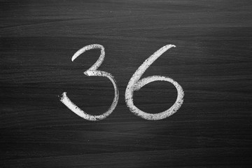 Wall Mural - number thirty six enumeration written with a chalk on the blackboard
