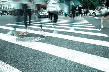 Wall Mural - Crosswalk and pedestrian at modern city zebra crossing street. Blur abstract.