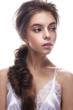 © iulskaya_photo - Beautiful girl in image of bride with plait. Model with nude makeup and silk underwear. Beauty face. Photo was taken in a studio.